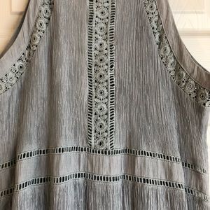 Floor length grey blue halter dress.